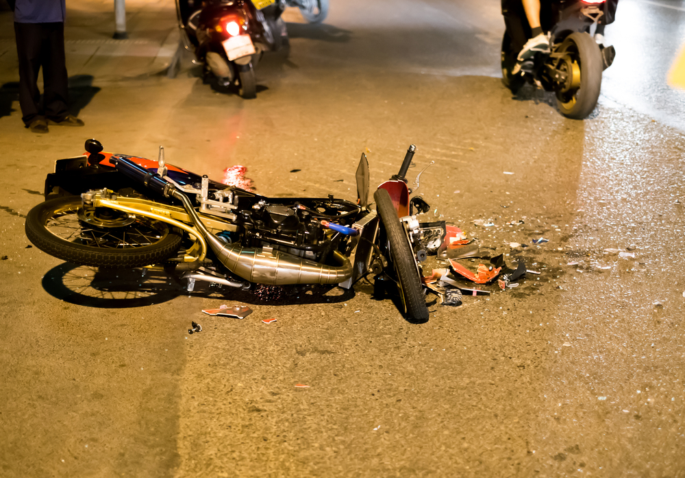 Motorcycle accident on road at night