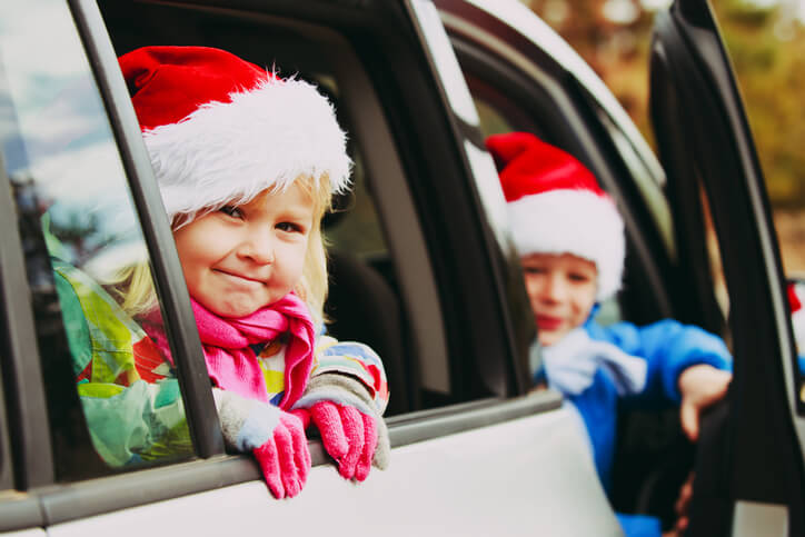 kids traveling in a car during the holidays