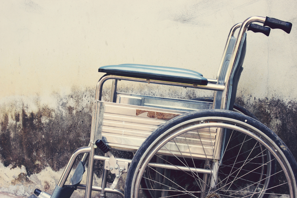 Old Wheelchairs with wall background